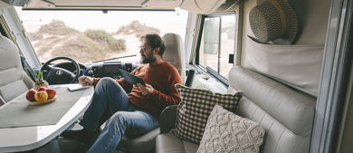 Man looking at tablet in his RV