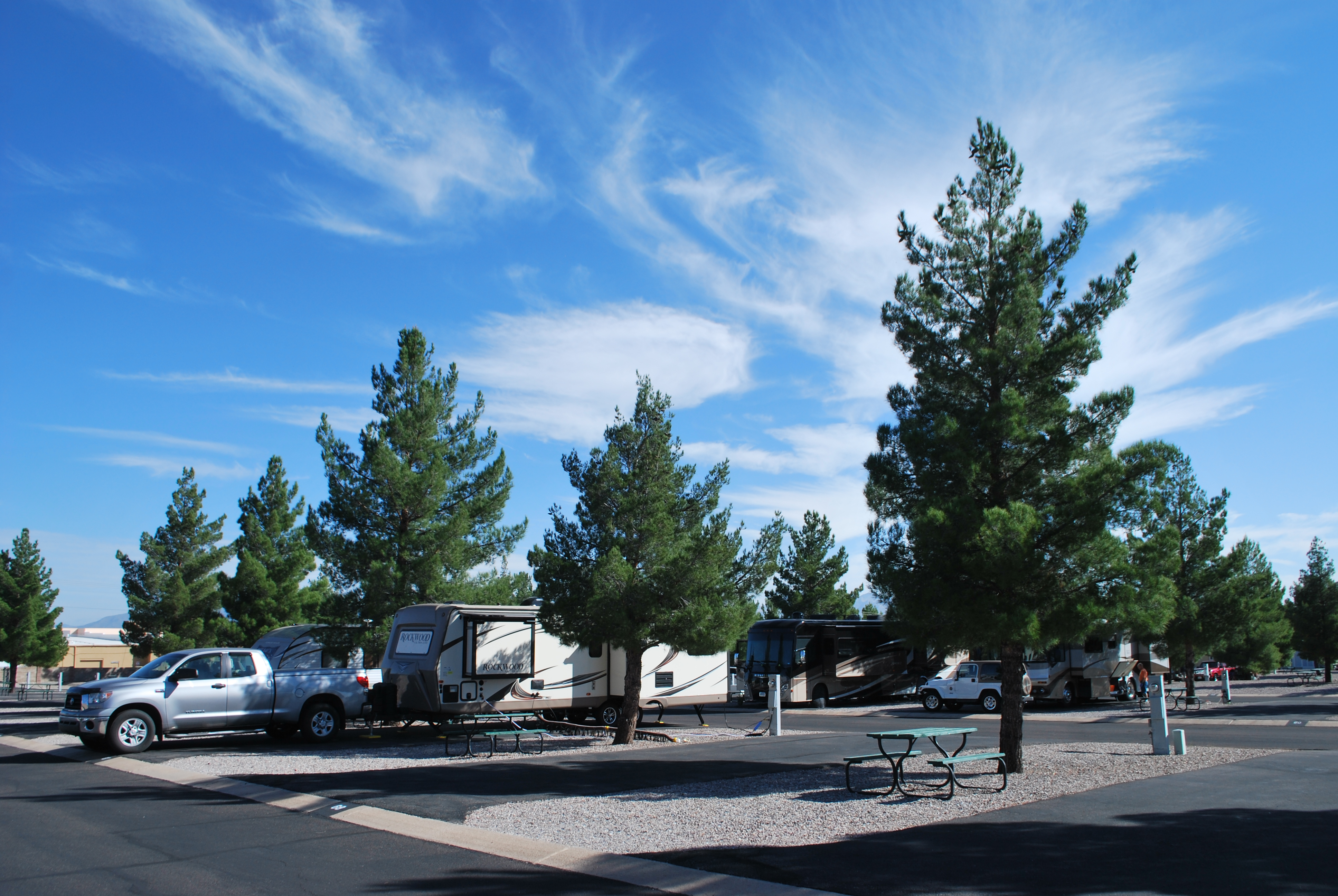 Truck pulling a travel trailer on a sunny day