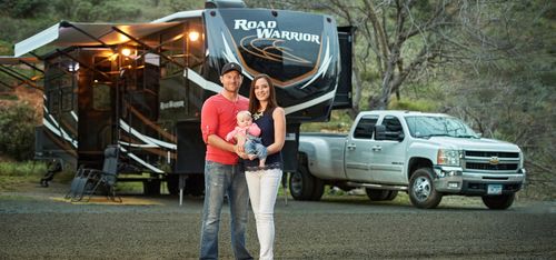 family in front of RV