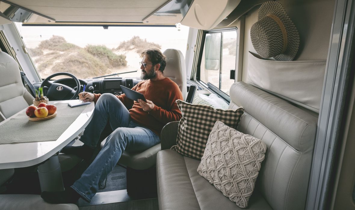 Man looking at tablet in his RV
