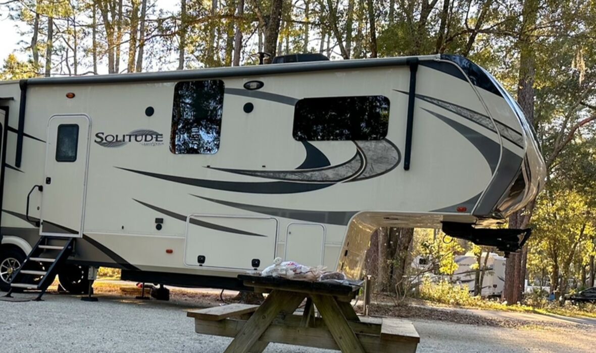 Fifth wheel next to campfire