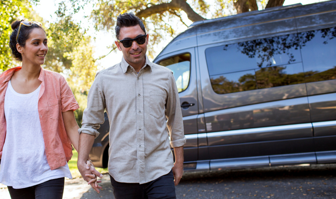 Couple exiting Class B campervan_h