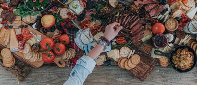 epic Charcuterie Board with hands