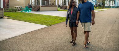 couple walking with Park Models