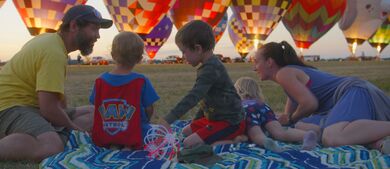Family enjoying hot air balloons