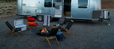 Airstream parked outside at a campsite
