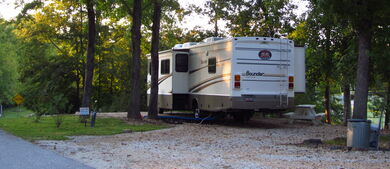 RV on gravel in the woods.jpg