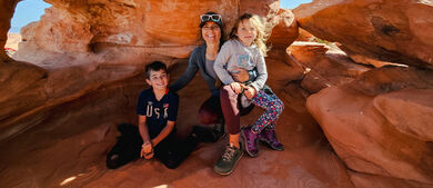 A photo of Kestra and her kids at the Flintstone House