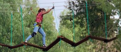 Girl completing a ropes course