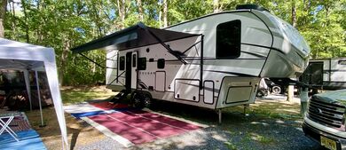 Fifth wheel trailer in the forest