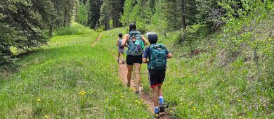 Bronneke family hiking in the woods