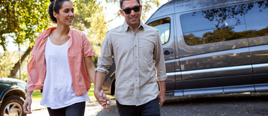 Couple exiting Class B campervan_h