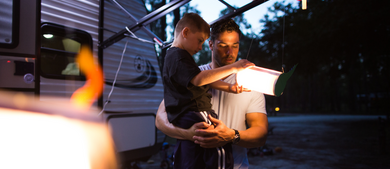 Family RV camping in woods_h