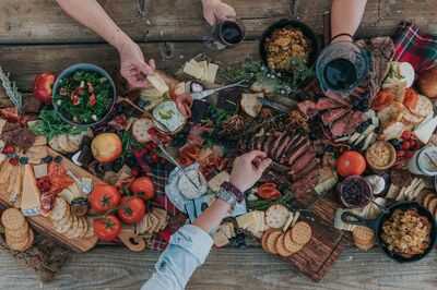 epic Charcuterie Board with hands