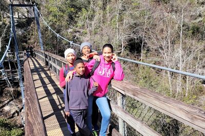family on a bridge