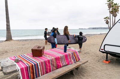 carrying a surfboard