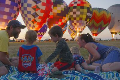 Family enjoying hot air balloons