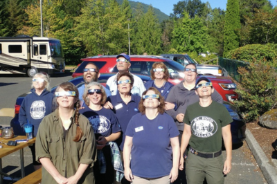 A group of people watching an eclipse.png