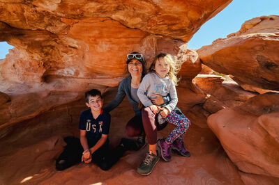 A photo of Kestra and her kids at the Flintstone House