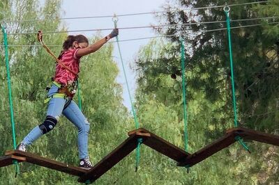 Girl completing a ropes course