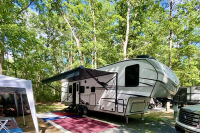 Fifth wheel trailer in the forest