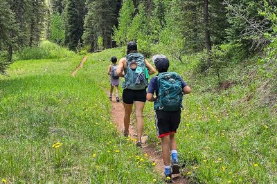 Bronneke family hiking in the woods