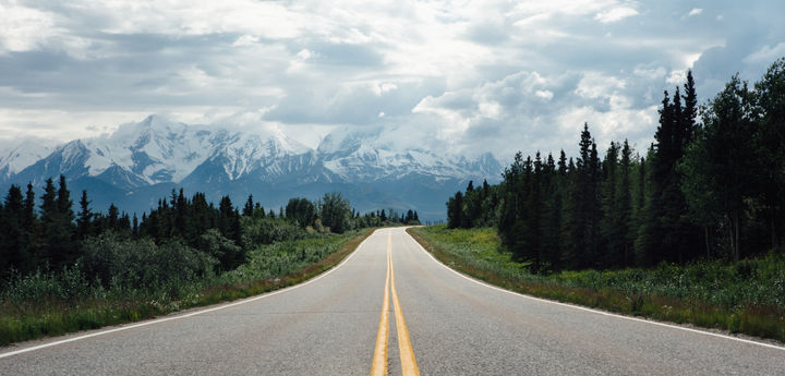 road with a cloudy sky