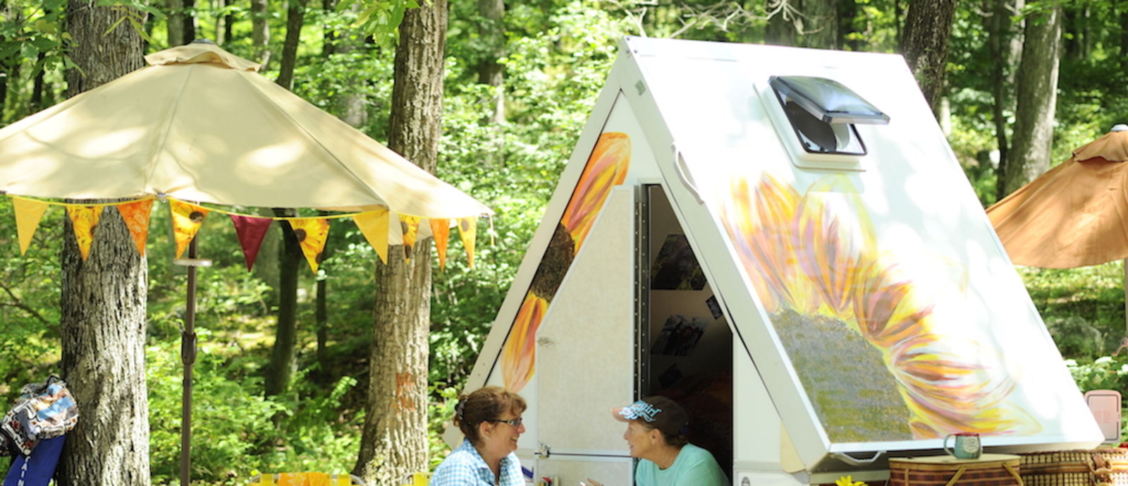 women talking on a camp site