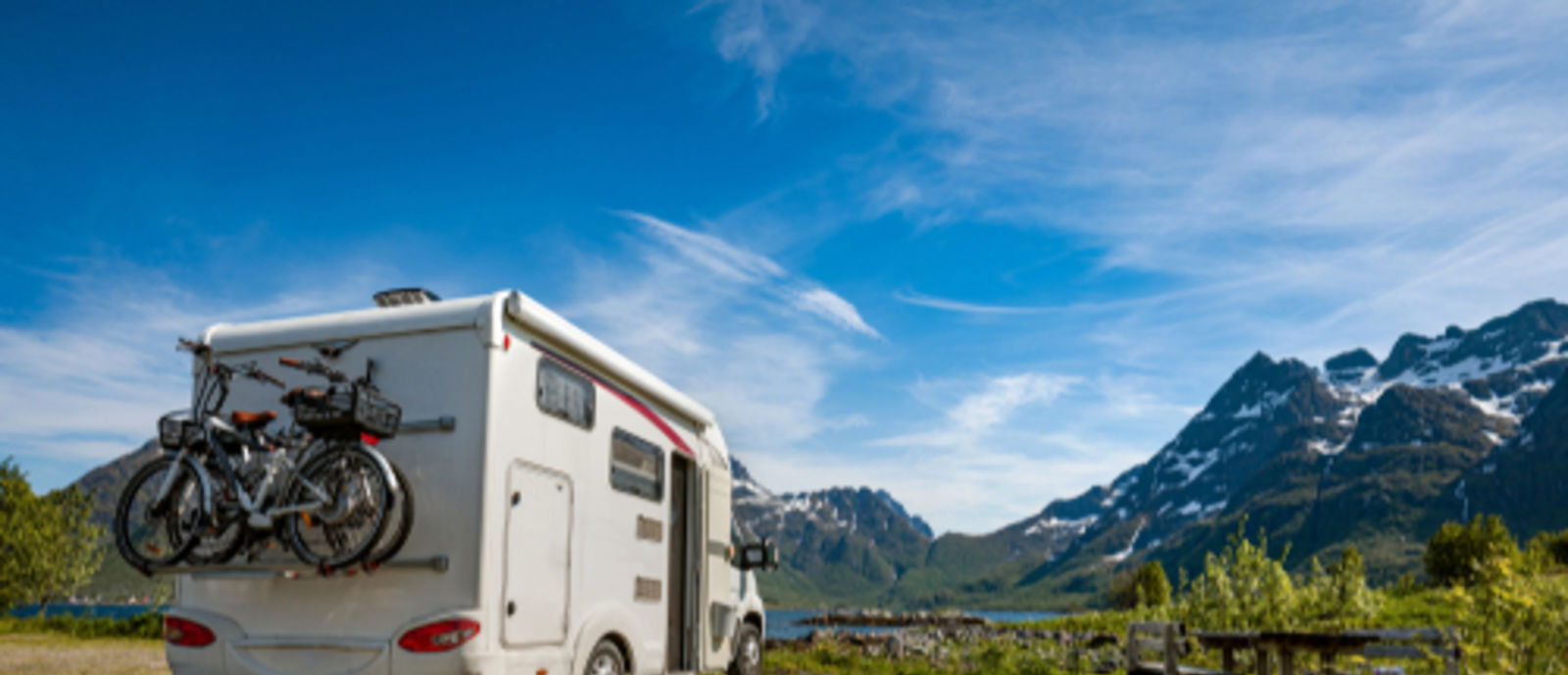 Class C with mountains at campground