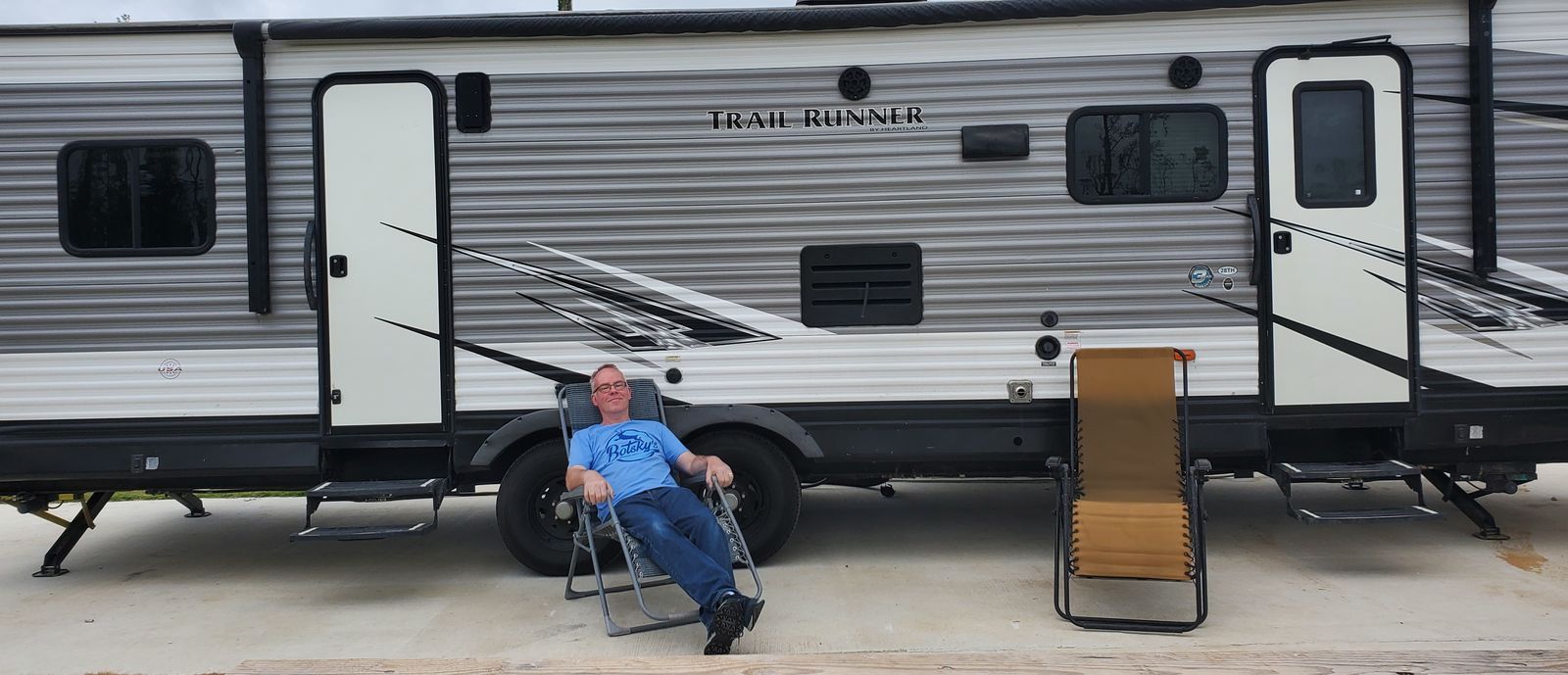 relaxing in front of RV at campsite
