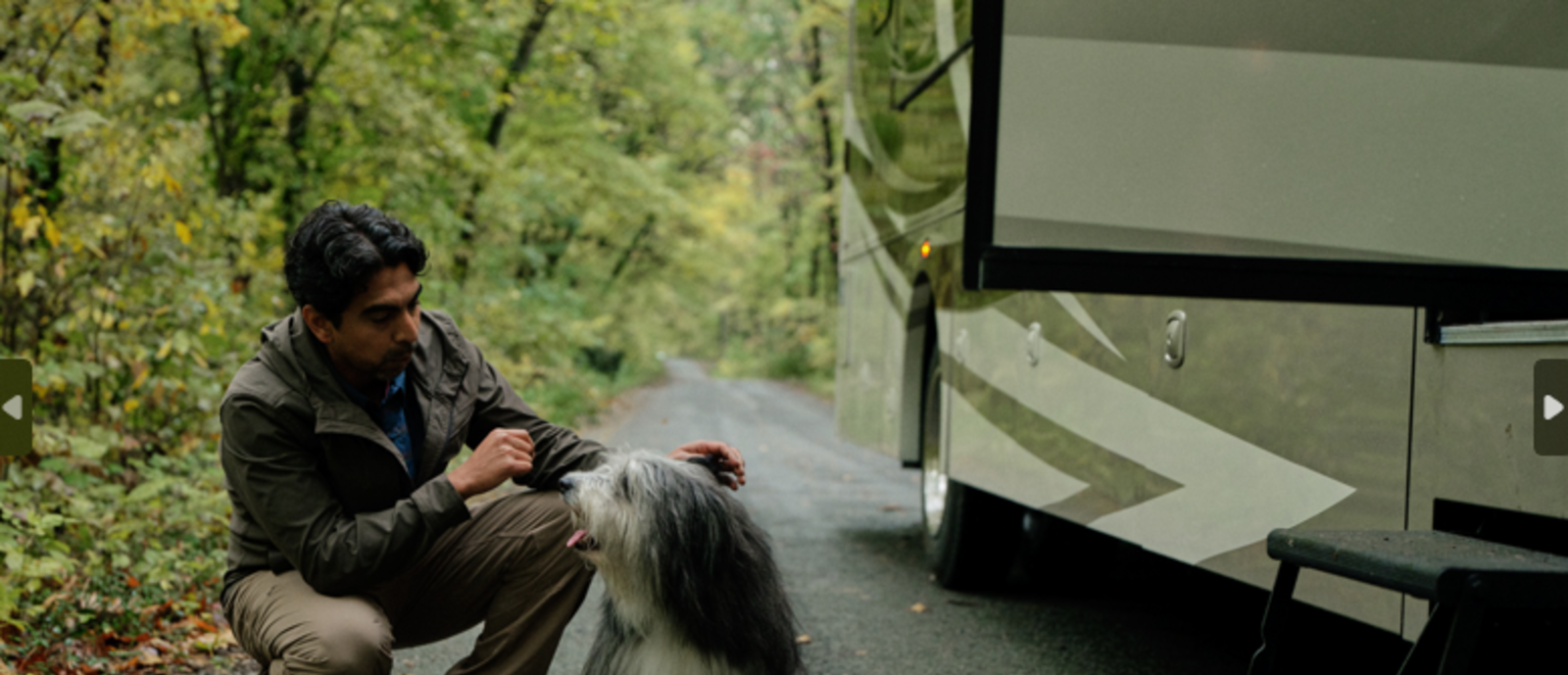owner and dog next to RV