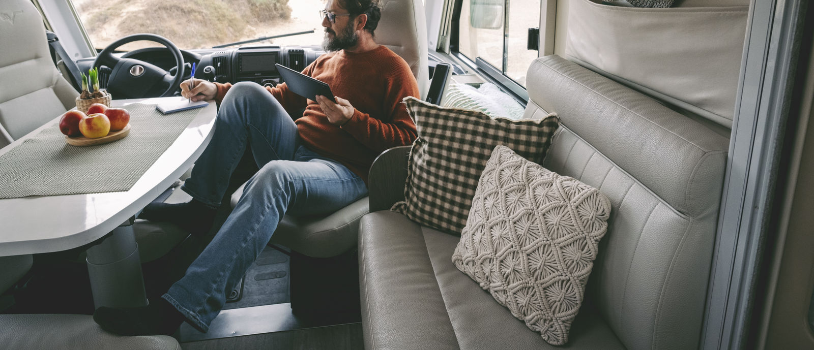 Man looking at tablet in his RV