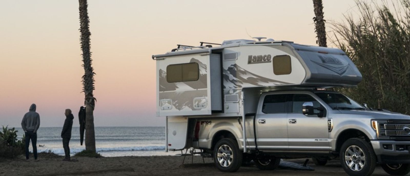 An RV on the beach in the evening