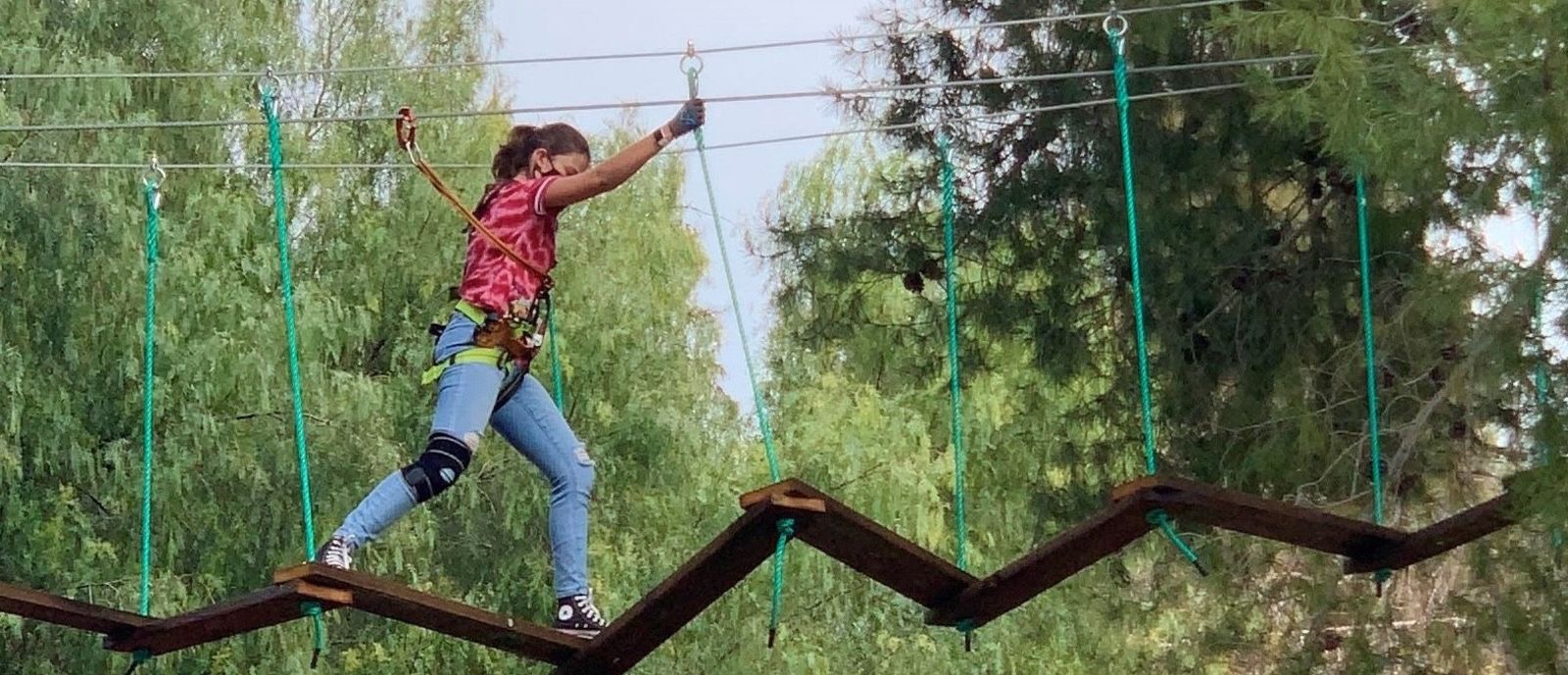 Girl completing a ropes course