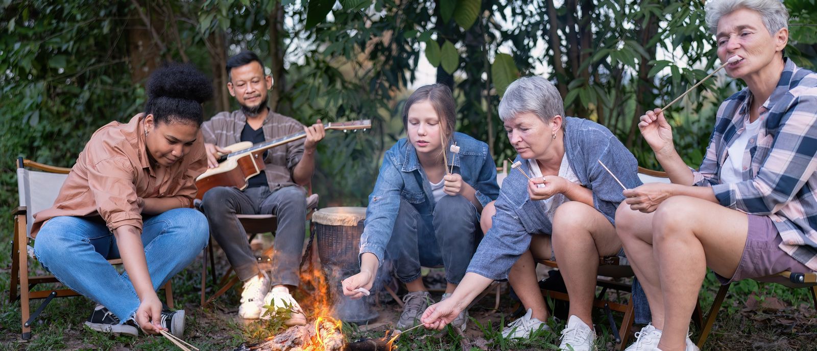 Individuals gathered around a campfire