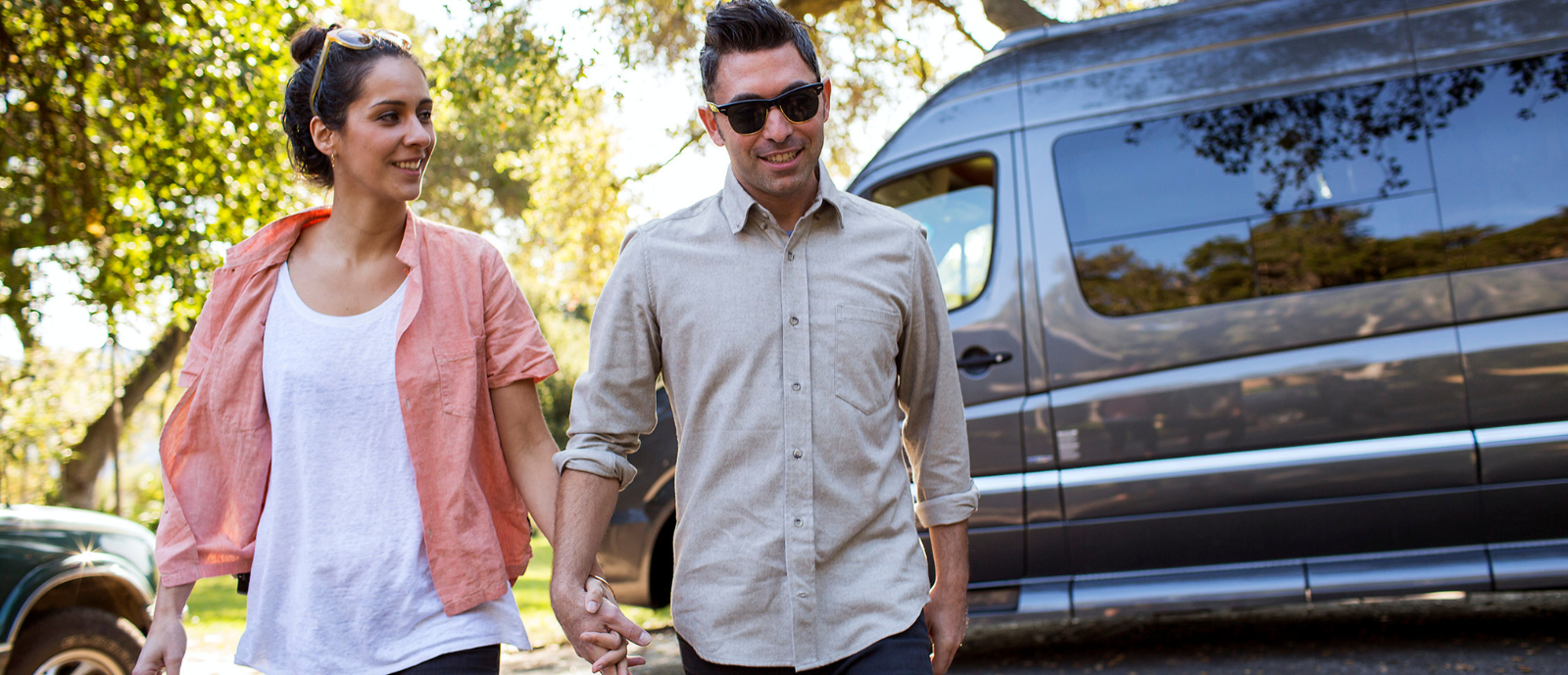 Couple exiting Class B campervan_h