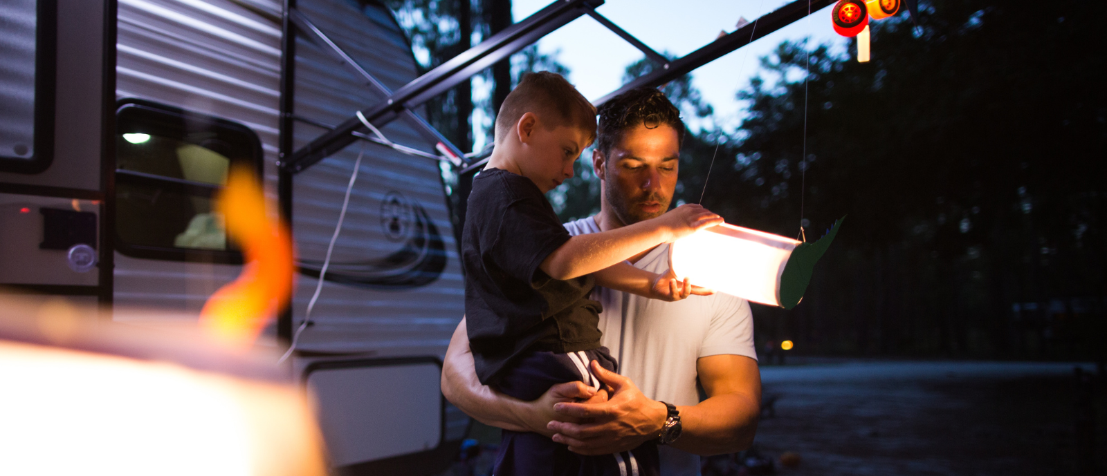 Family RV camping in woods_h