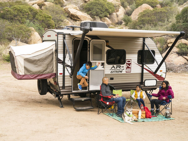 A family camps together at their RV.