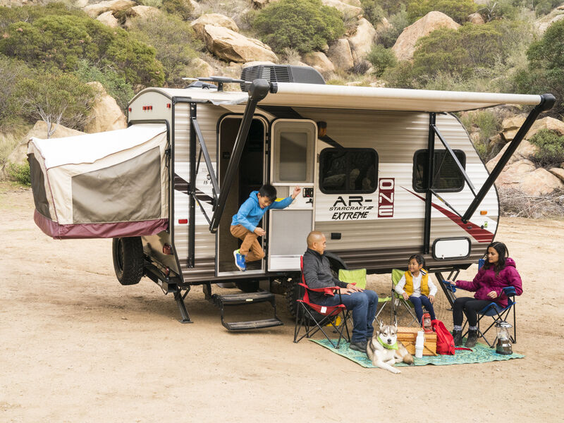 A family camps together at their RV.