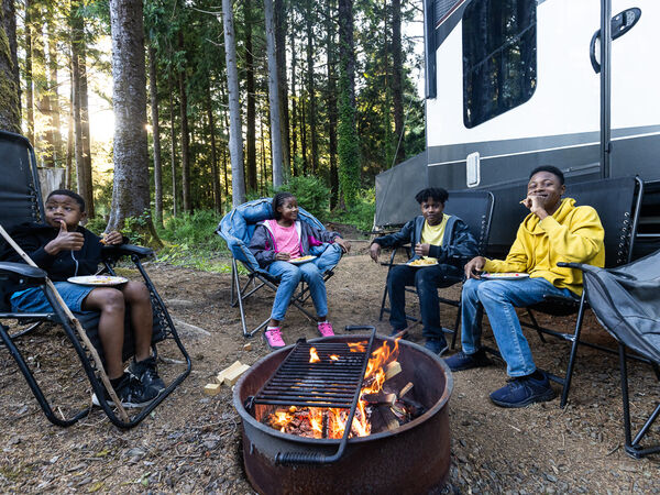 Family around campfire