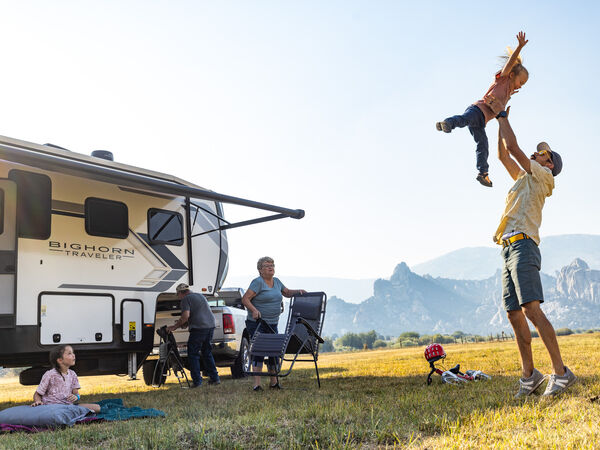 Family spending time together with mountains in the background