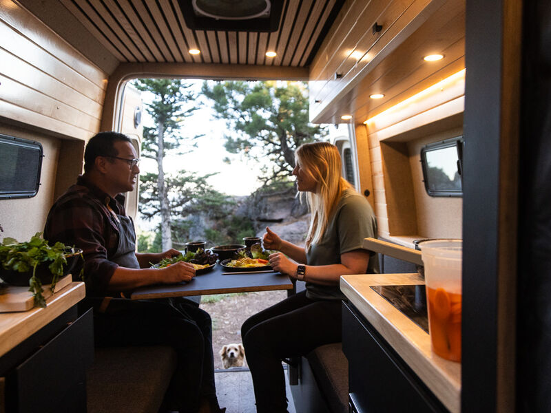 People sharing a meal in their RV