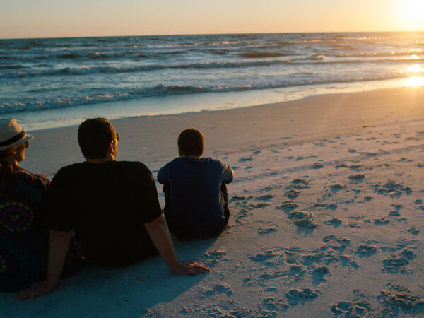 RVers enjoy the sunset at the beach.