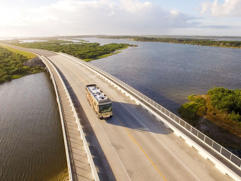 RV driving across bridge