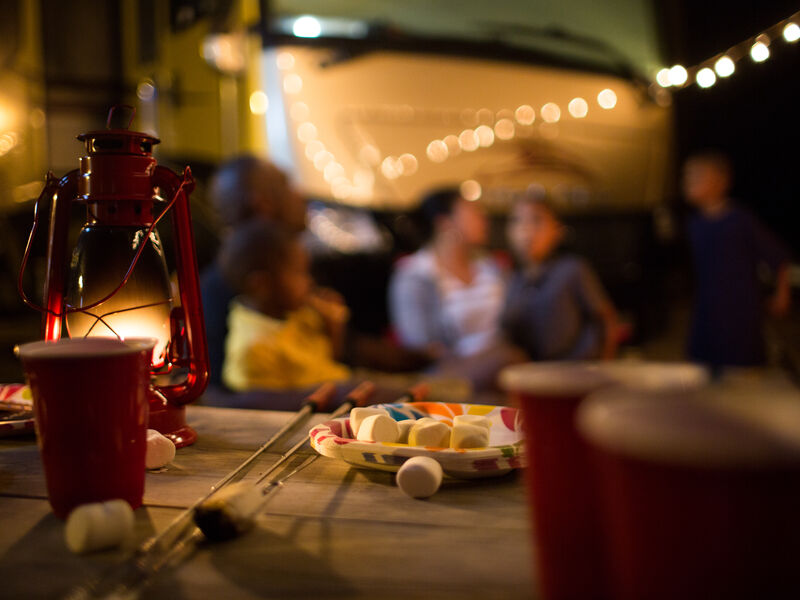 RVers enjoying evening near their RV.