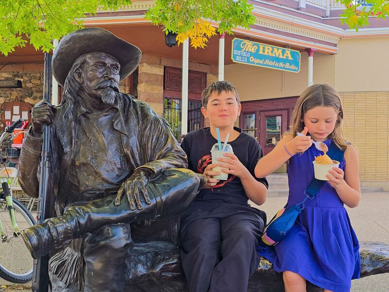 Kids enjoy ice cream near The Irma Hotel