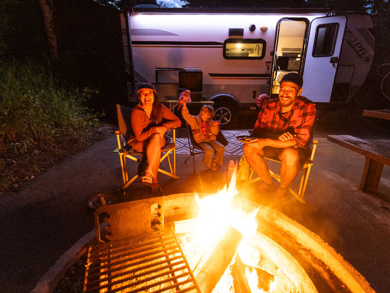 RVers gathered around campfire.