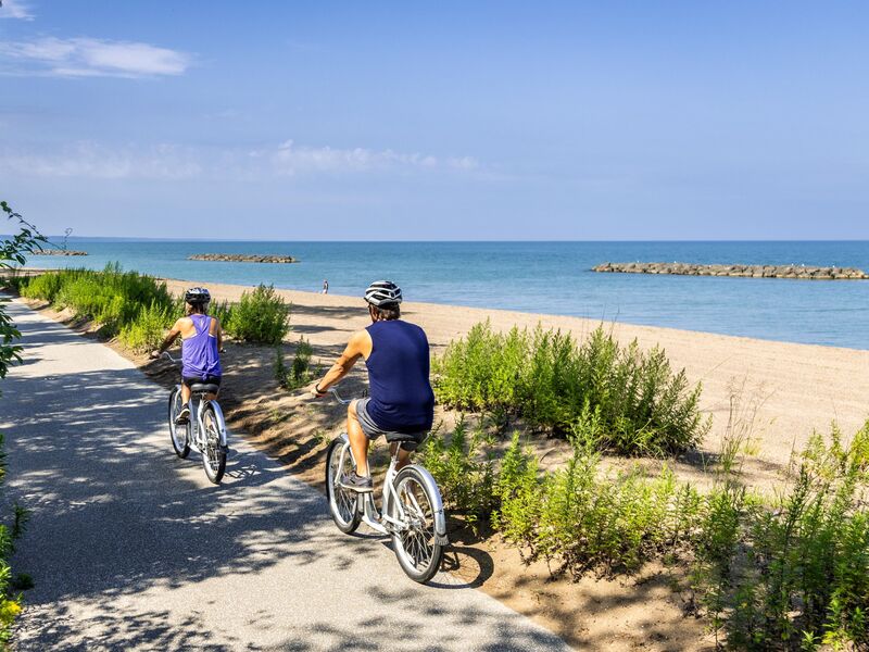 Couple Bicycling at Presque Isle State Park path, Paul Gibbens_Credit to VisitErie