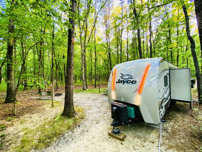 Jayco trailer in the woods